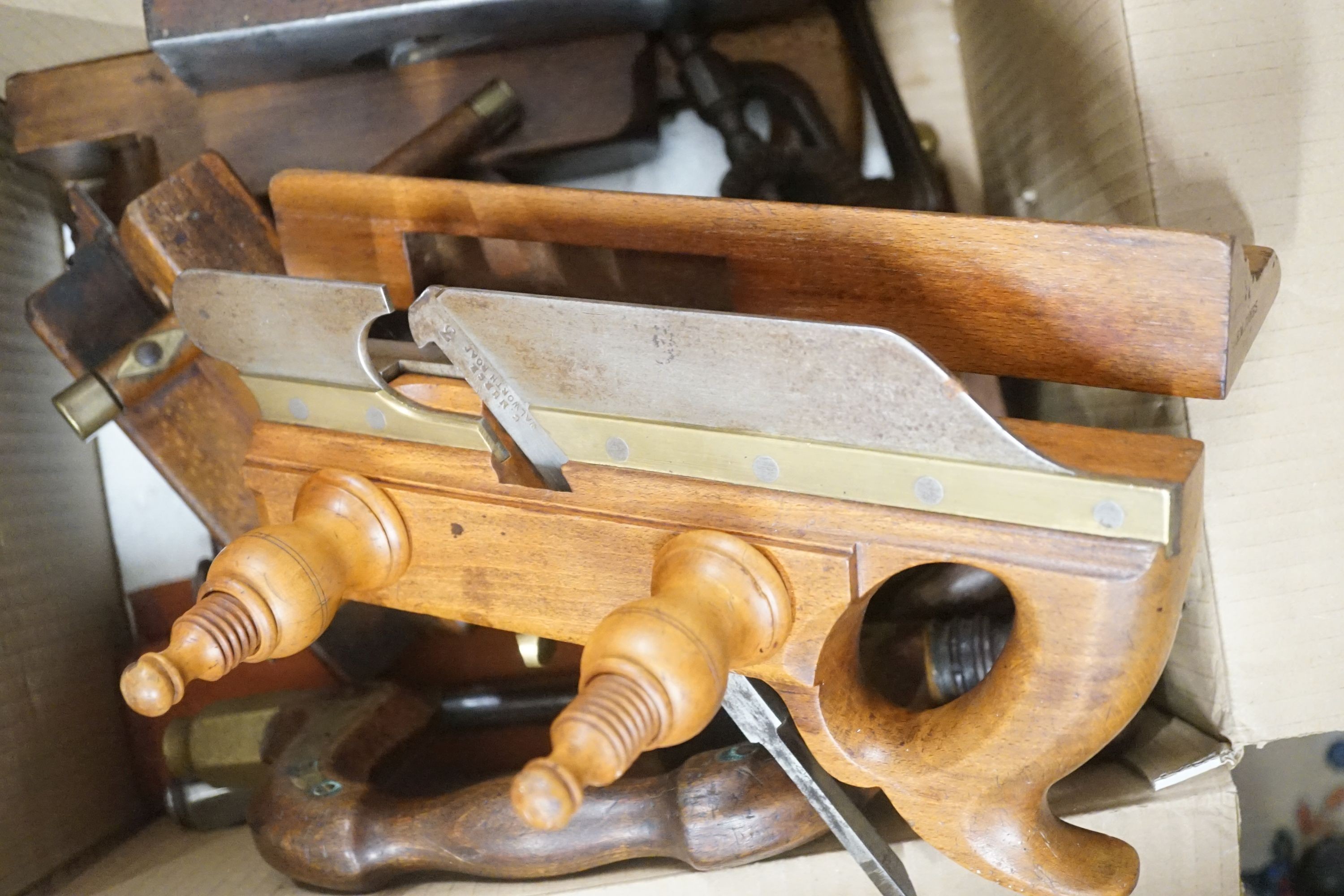 A large quantity of Victorian and later carpentry tools to include assorted steel and brass mounted planes, three Victorian pine trunks etc.